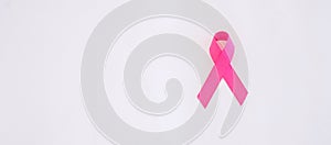 October Breast Cancer Awareness month, adult Woman  hand holding Pink Ribbon for supporting people living and illness.