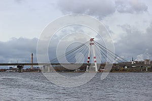 October bridge in the city of Cherepovets, Vologda Oblast, against the backdrop of a cloudy autumn sky