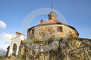 October evening at the foot of the old tower of Lars Torstensson Pugachev tower. Korela Fortress. Priozersk