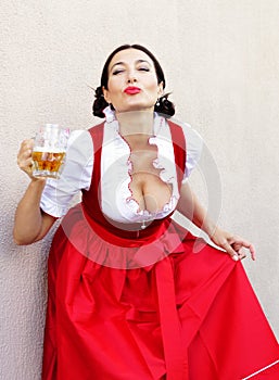 October fest concept.Beautiful german woman in typical oktoberfest dress dirndl