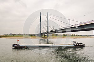 27 October 2018 Germany, Dusseldorf. North Rhine. Cargo ship, barge goes along the North Rhine river. Theme freight transport by