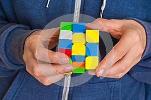 Rubik`s cube in female hands - game for solving problems