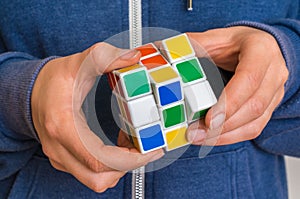 Rubik`s cube in female hands - game for solving problems