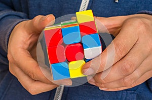 Rubik`s cube in female hands - game for solving problems