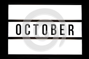 OCTOBER text in a light box