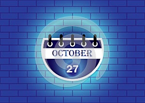 October 27th calendar date displayed on a blue brick wall background. Perfect for scheduling, reminders, or event planning photo