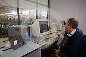 October 10, 2014. Ukraine.Kiev. Subject industry and people at work. Caucasians in the factory control room are closely monitoring