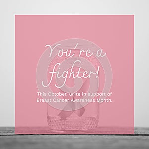 This october unite in support of breast cancer awareness month text and pink ribbon in jar