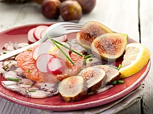 Octopus carpaccio over grapefruit