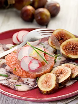 Octopus carpaccio over grapefruit