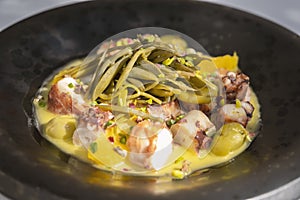 Octopus dish with orange fruit and lemon sauce