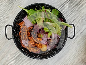 Octopus grilled: Peruvian dish served with fresh salad photo