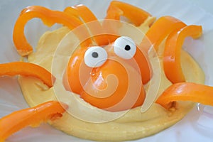 Octopus made out of capsicum inside a cream dip