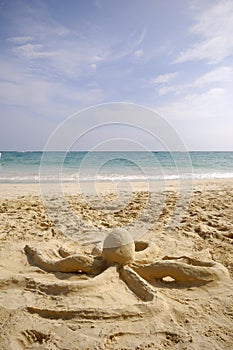 Octopus sculpture on beach