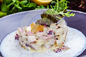 Octopus tartare with pike caviar on a plate