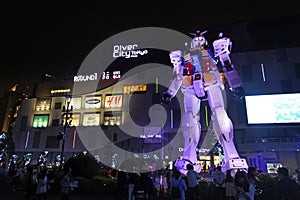 Odaiba Diver City Tokyo Plaza shopping mall and real-size Gundam robot in Tokyo, Japan