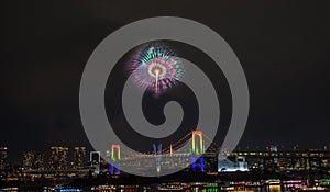 Odaiba,Minato,Tokyo,Japan on December7,2019:Rainbow Bridge as a perfect backdrop for fireworks during Odaiba Rainbow Winter Firewo