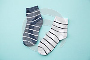 Odd socks day concept. Mismatch socks at blue.