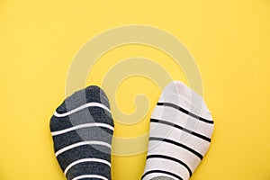 Odd socks day concept. Mismatch socks at blue.