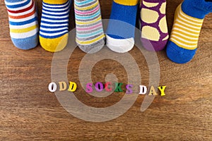 Odd Socks Day. Day lost socks, lonely socks on wooden background.