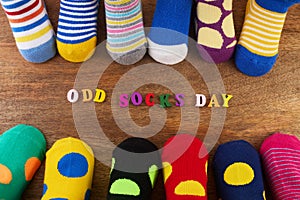 Odd Socks Day. Day lost socks, lonely socks on wooden background.