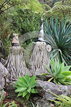 Odd tree husks dressed as wizards in garden