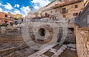Odeon in Taormina, Sicily island in Italy. Ruins of ancient greek theater in old town, antique amphitheater among among