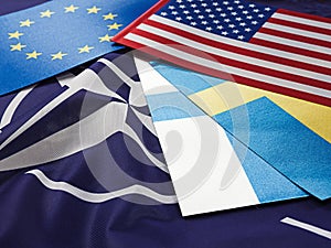 Odessa, Ukraine, February 24, 2023. USA Flags of Sweden, Turkey, Finland, EC, against the background of the symbol of the NATO