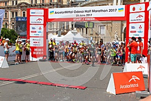 Marathon with children. Kid runners at starting line at summer maraton