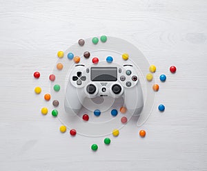 Odessa, Ukraine - june 11, 2012: The DualShock4 Wireless Controller for PlayStation4. Gamepad white for PS4 on a white wooden