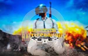 Odessa, Ukraine - May 13, 2019. White playstation 4 gamepad on the background of the game PUBG.  PLAYERUNKNOWN`S BATTLEGROUNDS