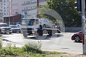 ODESSA, UKRAINE - October 16, 2019: Car accident, head-on collision. A tow truck loads a wrecked car after an accident. Traffic