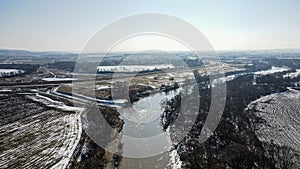 The Odra river flowing through the RacibÃ³rz dry flood control reservoir in winter in Silesia, Poland