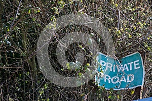 Off the beaten track. Road less travelled. Private road sign photo