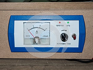 Off Blue ammeter on a wood background
