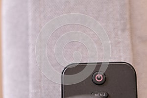 Off button on TV commander and its standing