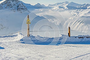 Off-piste sign at mountains in clouds with snow in winter