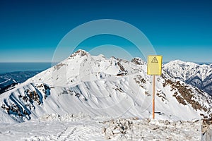 Off-piste sign. Winter mountain landscape. Krasnaya Polyana, Sochi, Russia