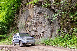 Off-road 4x4 car driving on a gravel road to Zekari Pass (Meskheti Range), Georgia
