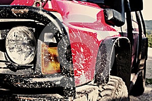 Off-road car covered in mud