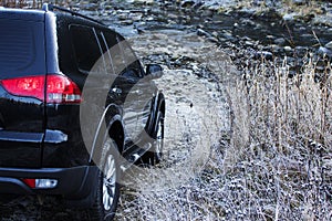 Off-road car driving mountain river