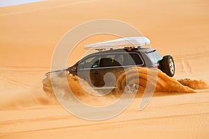 Off-road car fetching a dune, Libya - Africa