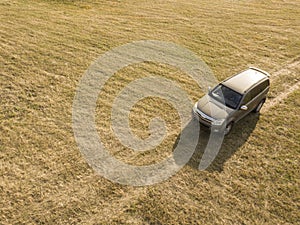 Off road car on the forest and field summer dirt road top view f