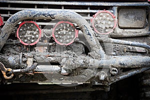 Off road car front, covered in mud