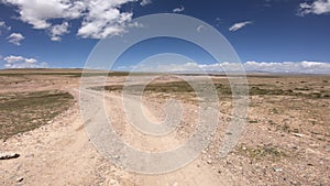 Off road car running on high altitude mountain trail