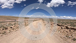 Off road car running on high altitude mountain trail