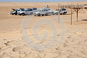 Off-road car at stoppage in desert not in focus