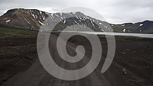 Off-road car vehicle drive on dirt road to Landmanalaugar on highlands Iceland.