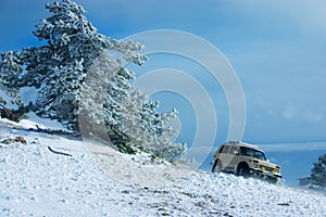 Off-road car on winter landscape