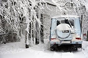 Off-road car in winter snow